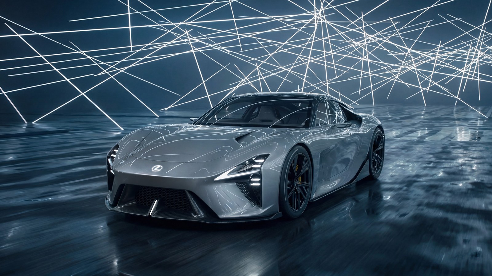 Silver Lexus LFA Concept seen from the front three-quarter on a wet dark floor under crossing white light beams, showing its low hood, slim L-shaped headlights, large lower grille and black multi-spoke wheels