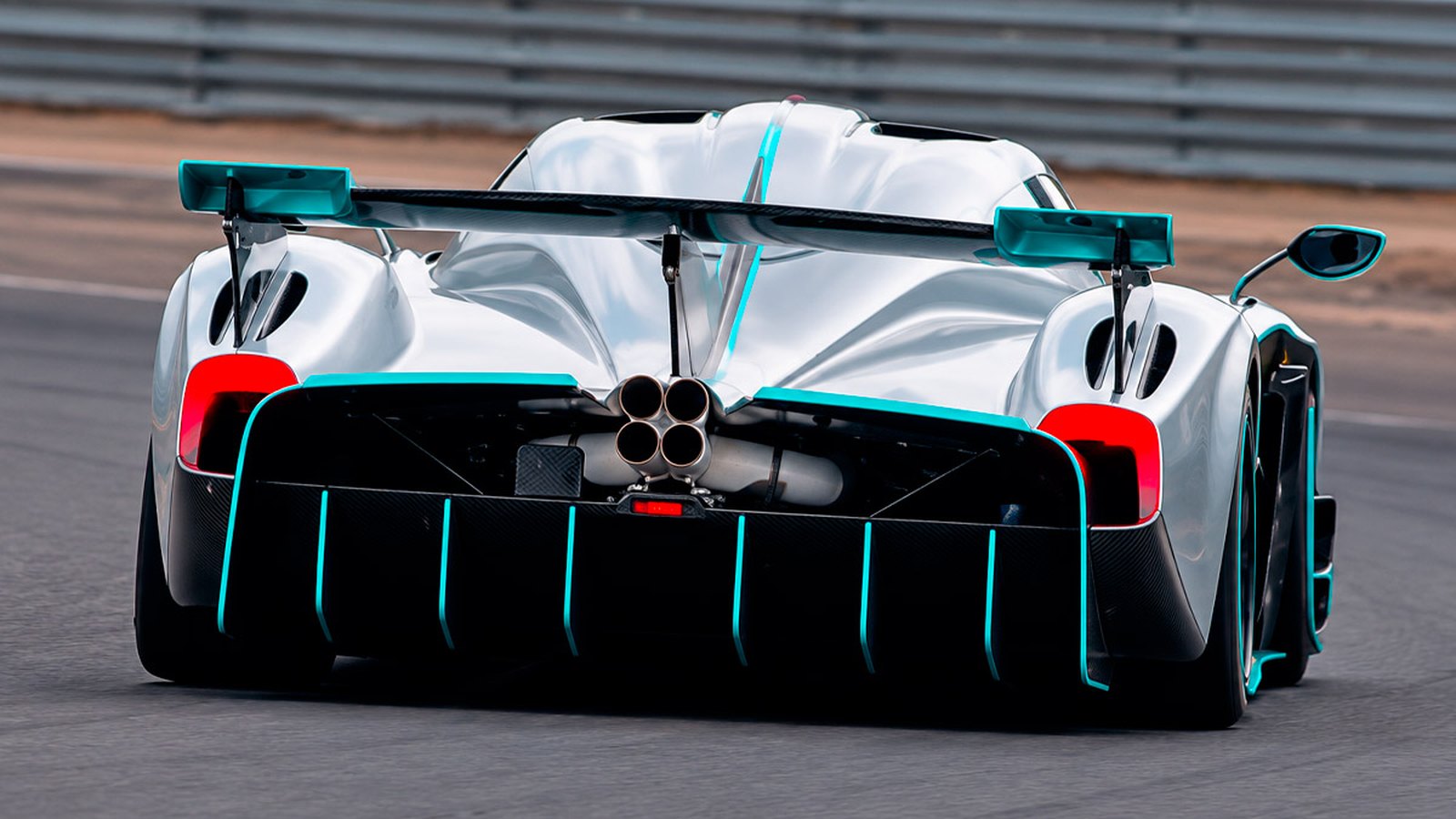 Pagani Huayra R Evo Roadster on track from behind, wing and teal diffuser fins visible